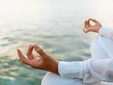 5906336-woman-practicing-yoga-at-sunrise