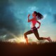 Composite image of full length of healthy woman jogging