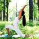 yoga woman on green park background