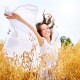 Beautiful Happy Girl on the Wheat Field