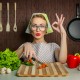 Happy woman cook with okay sign cut carrot-vintage concept