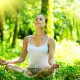 Young Woman doing Yoga Exercises Outdoor